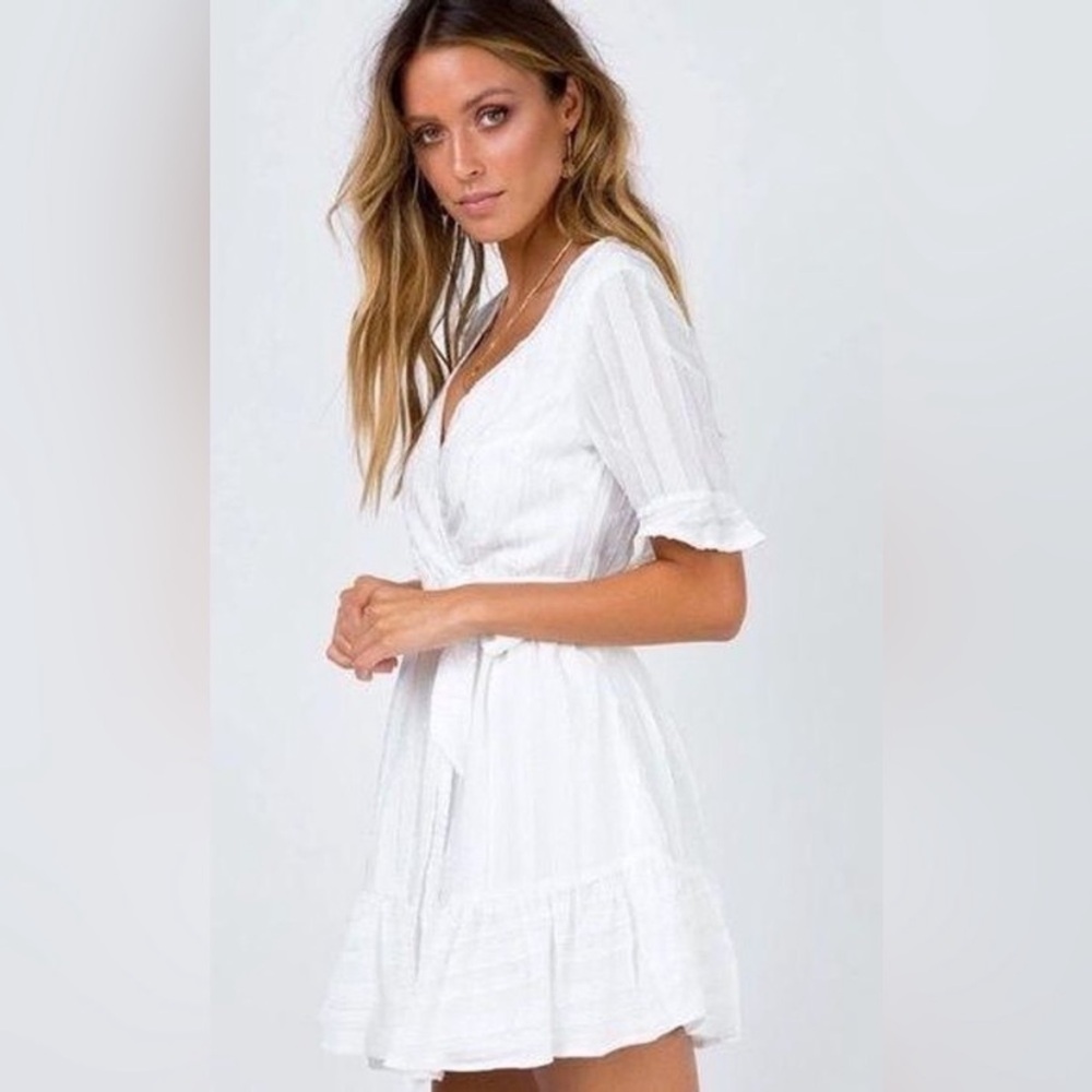 White short sleeve wrap dress with beautiful texture and ruffle sleeves
